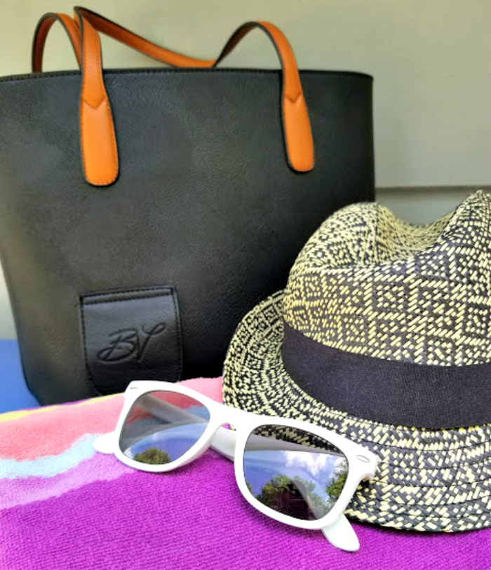 List Of Essentials For A Perfect Day At The Beach hat and gkasses